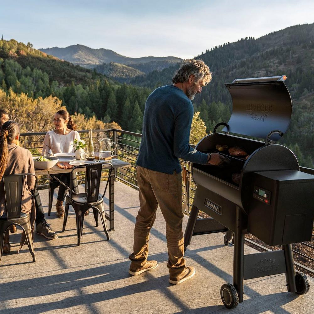 Traeger Ironwood Series 885 Pellet Grill Cooking Outside with Mountain View