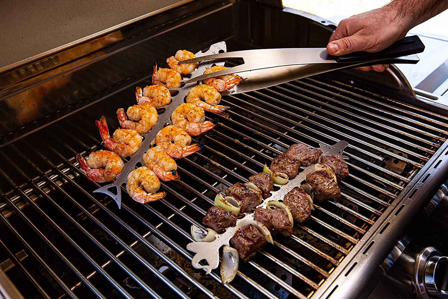 Proud Grill Slide and Serve BBQ Skewers used with Shrimps on it and Steak on the Grill