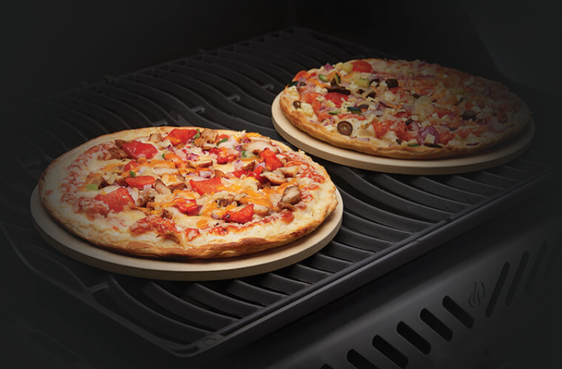 Napoleon 10 Inch Personal Sized Pizza/Baking Stone Set on the Grill with Pizza on Top