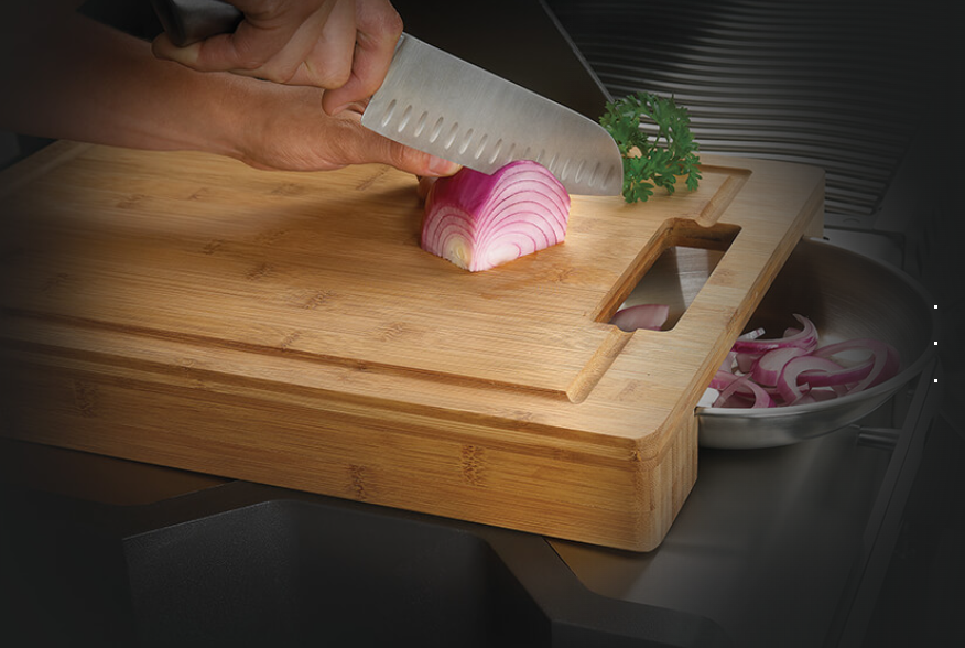 Napoleon Cutting Board with Stainless Steel Bowls Lifestyle on the Grill Cutting Onion