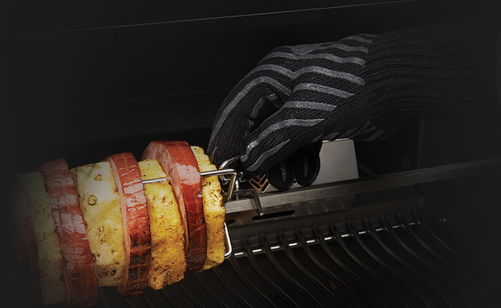 Napoleon Heat Resistant BBQ Gloves Used in Adjusting Skewers