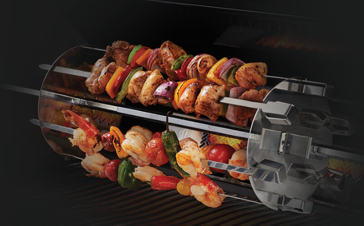 Napoleon Rotisserie Shish-Kebab Skewer Set on the Grill with Pork and Shrimps on it