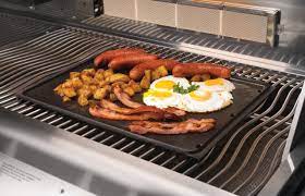 Napoleon Cast Iron Reversible Griddle on the Grill with Eggs and Sausages