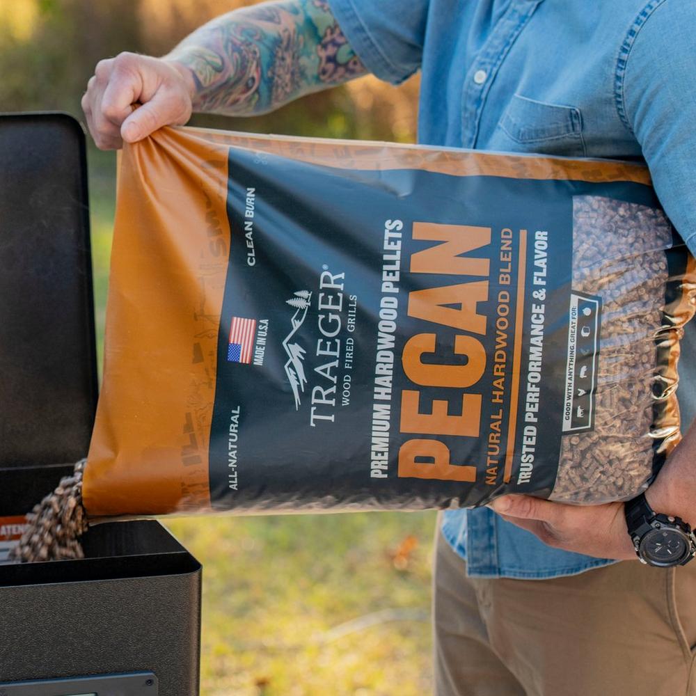 Traeger Pecan BBQ Wood Pellets Pouring it on the Grill