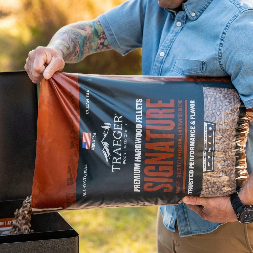 Traeger Signature Blend Wood Pellets Pouring it on the Grill