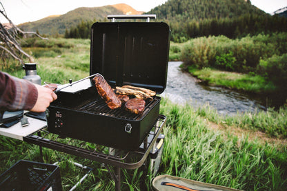 Traeger Ranger Portable Pellet Grill Front Angle with Steaks